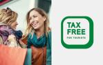 Po lewej stronie dwie kobiety uśmiechające się do siebie, po prawej zielony napis Tax Free for Tourists.